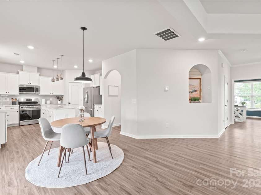 16726 Cozy Cove Road, Charlotte, NC 28278.  MLS# CAR4288880, YatesRealty ID 30958. From kitchen to dining, this open layout keeps everyone connected—whether it’s dinner with family or entertaining friends.