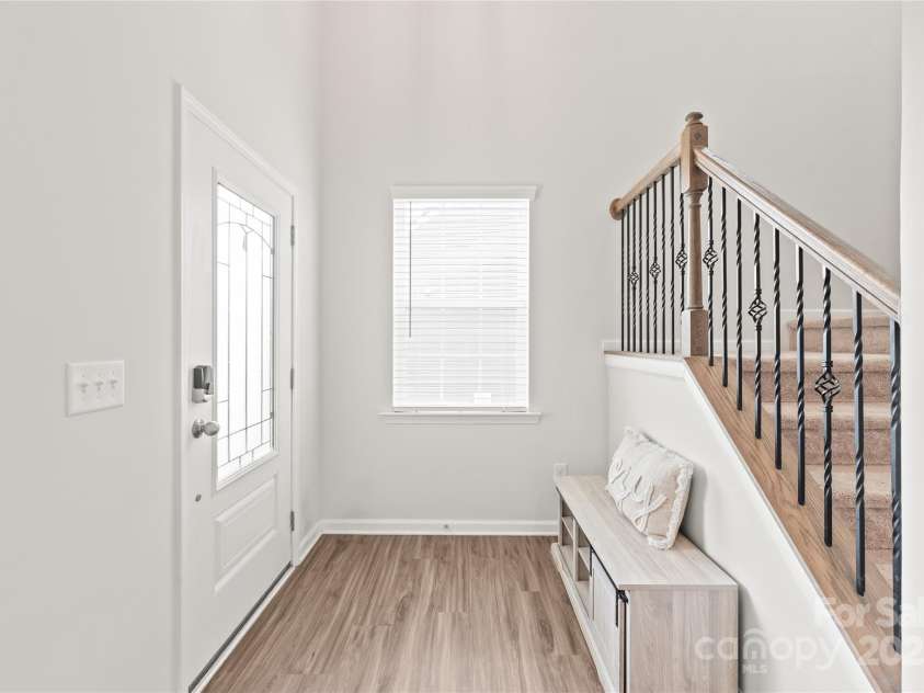 16726 Cozy Cove Road, Charlotte, NC 28278.  MLS# CAR4288880, YatesRealty ID 30958. Step inside to a stunning two-story entry that sets the tone with space, light, and a lasting first impression.
