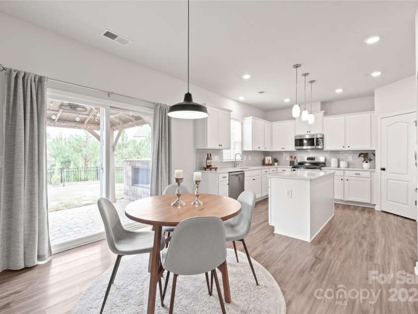 16726 Cozy Cove Road, Charlotte, NC 28278.  MLS# CAR4288880, YatesRealty ID 30958. The dining area opens to the gazebo-covered patio, making it perfect for indoor meals or outdoor moments.