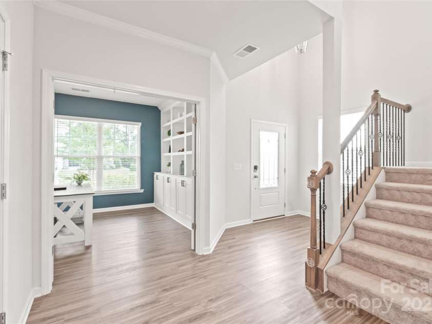16726 Cozy Cove Road, Charlotte, NC 28278.  MLS# CAR4288880, YatesRealty ID 30958. Whether it’s a home office, library, or playroom, this flex space with built-ins and French doors adapts to fit your life.