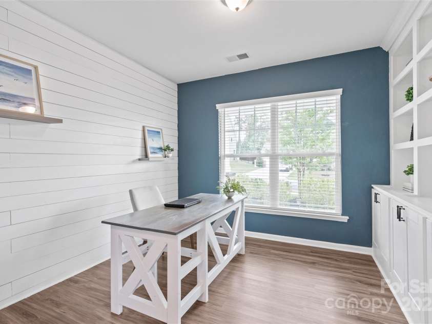16726 Cozy Cove Road, Charlotte, NC 28278.  MLS# CAR4288880, YatesRealty ID 30958. With its eye-catching shiplap wall, this office/flex room blends modern design with everyday function.