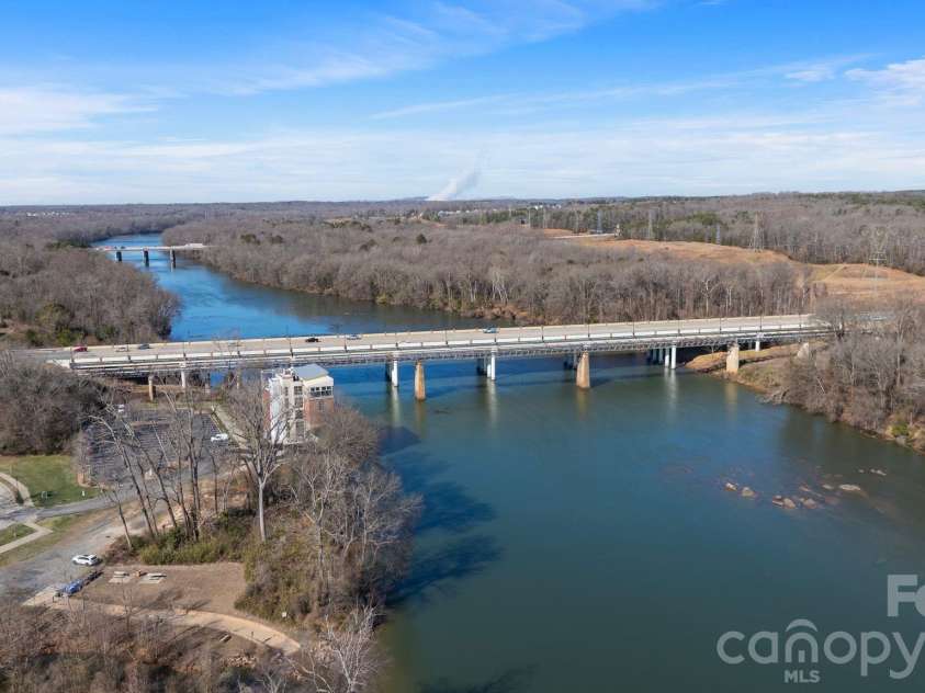 684 Dunkins Ferry Road, Rock Hill, SC 29730.  MLS# CAR4341419, YatesRealty ID 3096. Riverwalk, kayak launch, scenic river trails, playgrounds, sports fields, fitness center, grocery store, and waterfront dining!