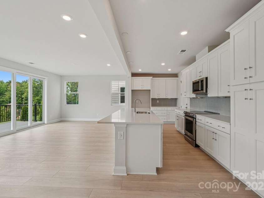 921 Coast Drive, Tega Cay, SC 29708.  MLS# CAR4289749, YatesRealty ID 30964. Kitchen into dining
