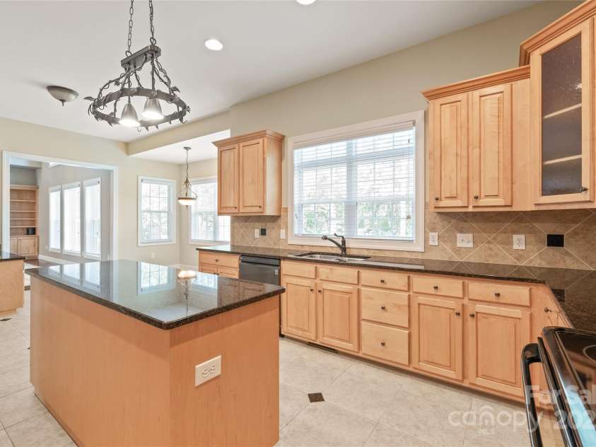 203 Vanderbilt Boulevard, Locust, NC 28097.  MLS# CAR4289783, YatesRealty ID 30966. Abundant Cabinetry and Prep Space