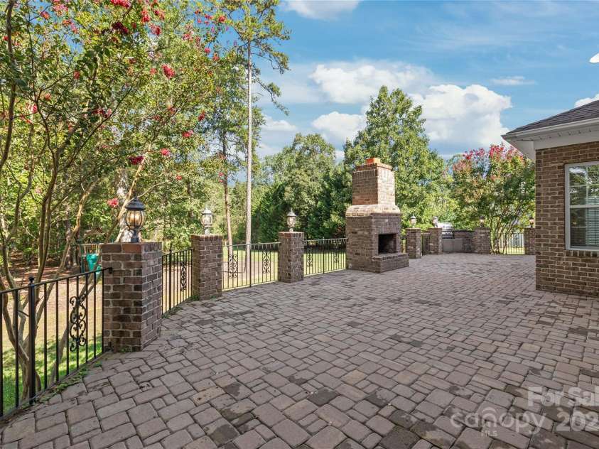 203 Vanderbilt Boulevard, Locust, NC 28097.  MLS# CAR4289783, YatesRealty ID 30966. Massive Paver Patio with Fireplace