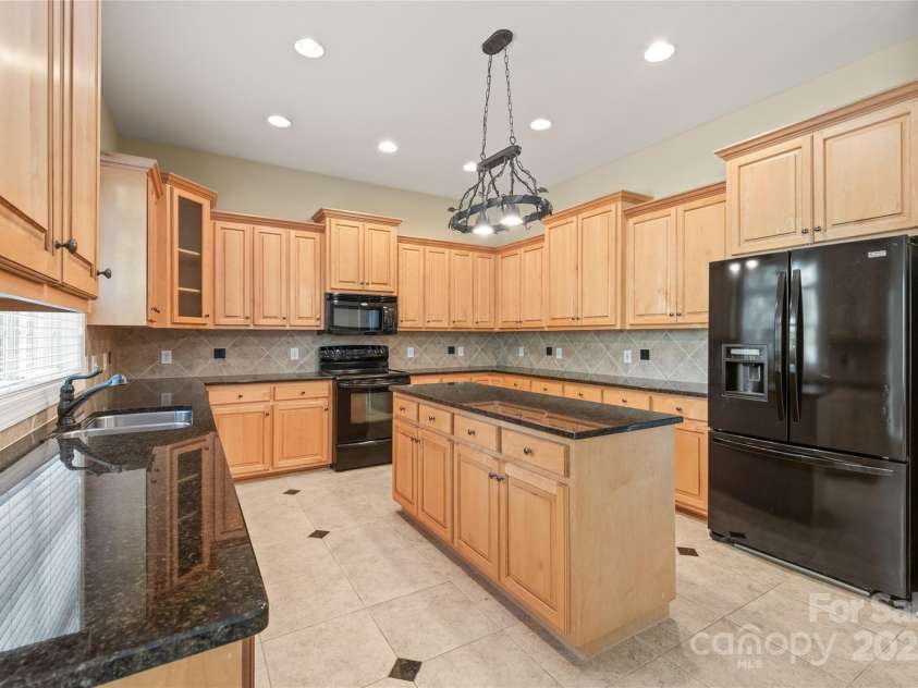 203 Vanderbilt Boulevard, Locust, NC 28097.  MLS# CAR4289783, YatesRealty ID 30966. Spacious and Functional Kitchen