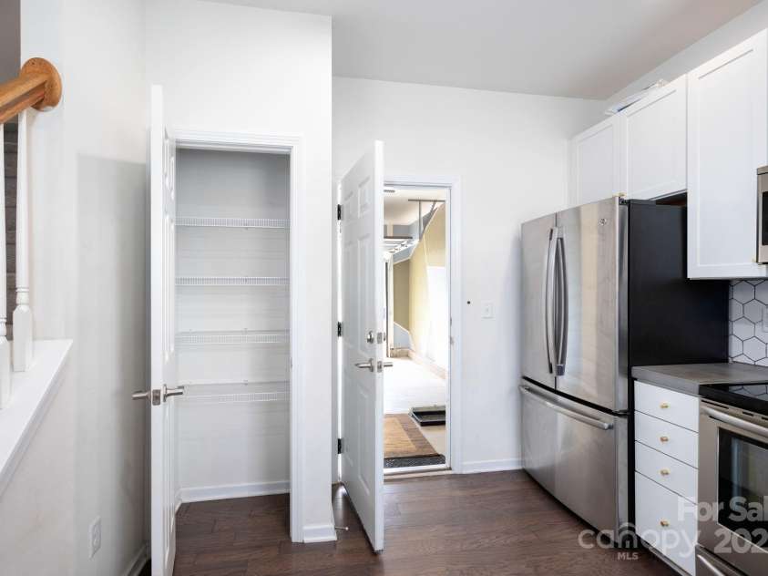 8 Ringed Teal Court, Arden, NC 28704.  MLS# CAR4289804, YatesRealty ID 30967. Kitchen pantry and Garage entrance