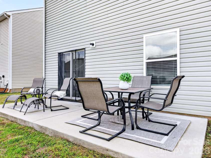 8128 Derby Woods Lane, Charlotte, NC 28214.  MLS# CAR4385212, YatesRealty ID 30971. Extended rear patio