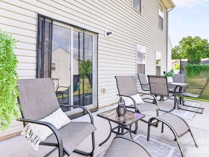 8128 Derby Woods Lane, Charlotte, NC 28214.  MLS# CAR4385212, YatesRealty ID 30971. Extended rear patio