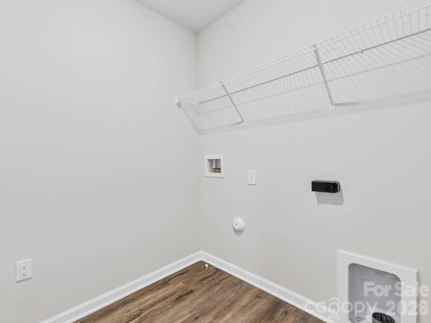 8128 Derby Woods Lane, Charlotte, NC 28214.  MLS# CAR4385212, YatesRealty ID 30971. Upstairs laundry room