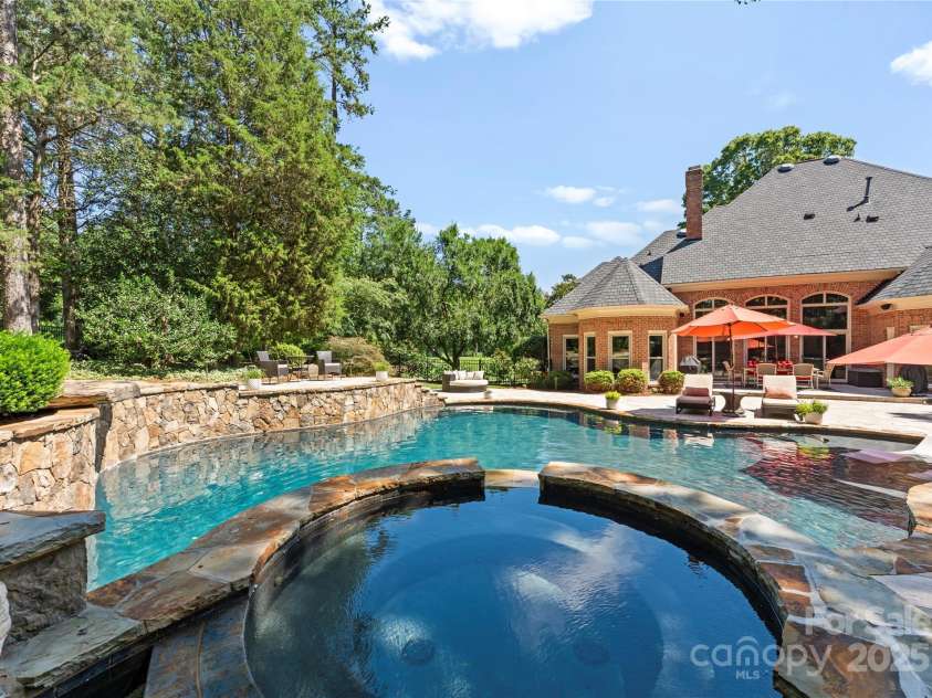 18600 River Falls Drive, Davidson, NC 28036.  MLS# CAR4231533, YatesRealty ID 30985. Both pool and jetted spa can be heated for year round use!