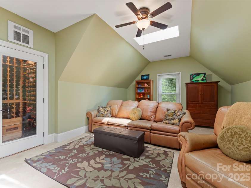 18600 River Falls Drive, Davidson, NC 28036.  MLS# CAR4231533, YatesRealty ID 30985. Flex Room / Billiards Room with Sky Lights and Wine Storage Room.
