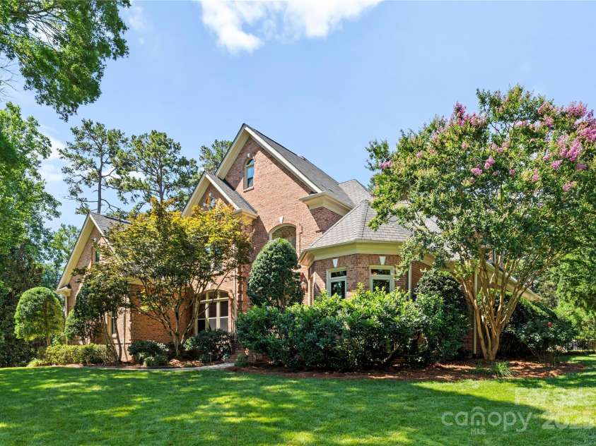 18600 River Falls Drive, Davidson, NC 28036.  MLS# CAR4231533, YatesRealty ID 30985. Home is perched at the top of a gently sloped front yard.