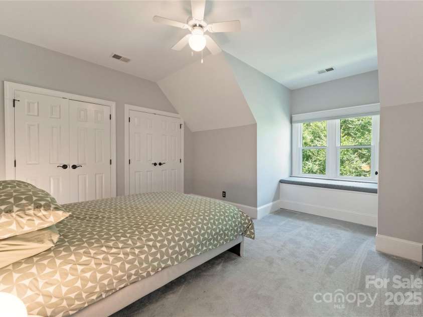 18600 River Falls Drive, Davidson, NC 28036.  MLS# CAR4231533, YatesRealty ID 30985. Upstairs Bedroom #2 has a built in window bench and ensuite bathroom.