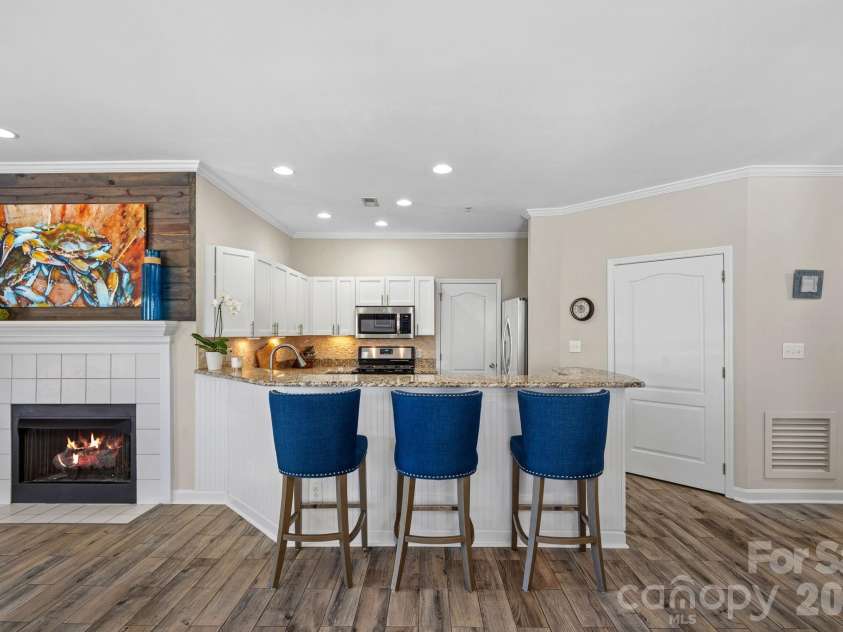 18609 Harborside Drive, Cornelius, NC 28031.  MLS# CAR4383156, YatesRealty ID 30987. Open kitchen with counter seating for casual meals or entertaining. Laundry room off kitchen features built-in shelving for pantry items.