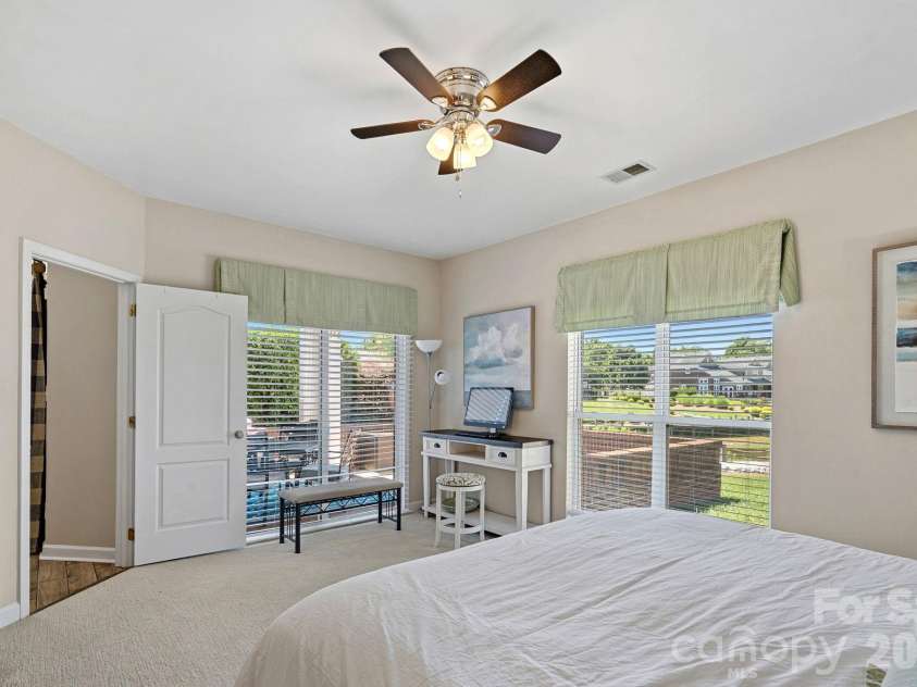 18609 Harborside Drive, Cornelius, NC 28031.  MLS# CAR4383156, YatesRealty ID 30987. Spacious primary suite, also with Lake Norman views!