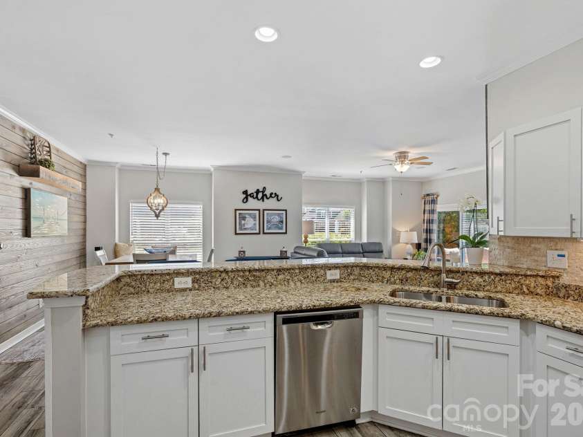 18609 Harborside Drive, Cornelius, NC 28031.  MLS# CAR4383156, YatesRealty ID 30987. Thoughtfully designed for everyday living and entertaining, the open kitchen features stainless steel appliances, abundant storage, and generous counter space for effortless meal preparation.