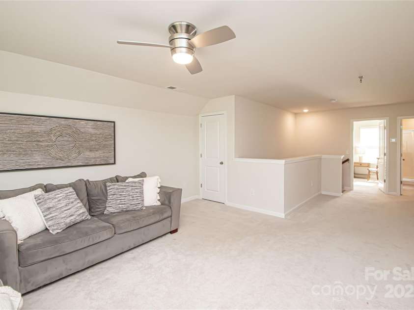 17637 Snug Harbor Road, Charlotte, NC 28278.  MLS# CAR4283392, YatesRealty ID 30990. The third level features a spacious bonus room, private bedroom, and full bathroom—offering excellent privacy for guests or extended family.