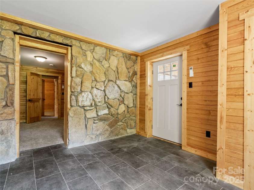 137 Red Maple Lane, Burnsville, NC 28714.  MLS# CAR4239902, YatesRealty ID 3100. Back Entrance to Lower Level