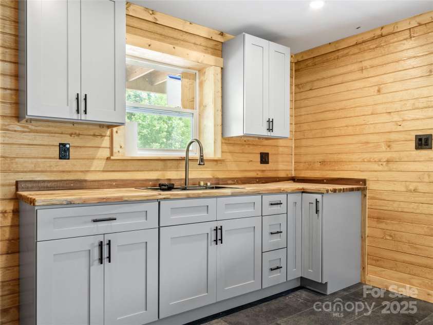 137 Red Maple Lane, Burnsville, NC 28714.  MLS# CAR4239902, YatesRealty ID 3100. Lower Floor Kitchen Area