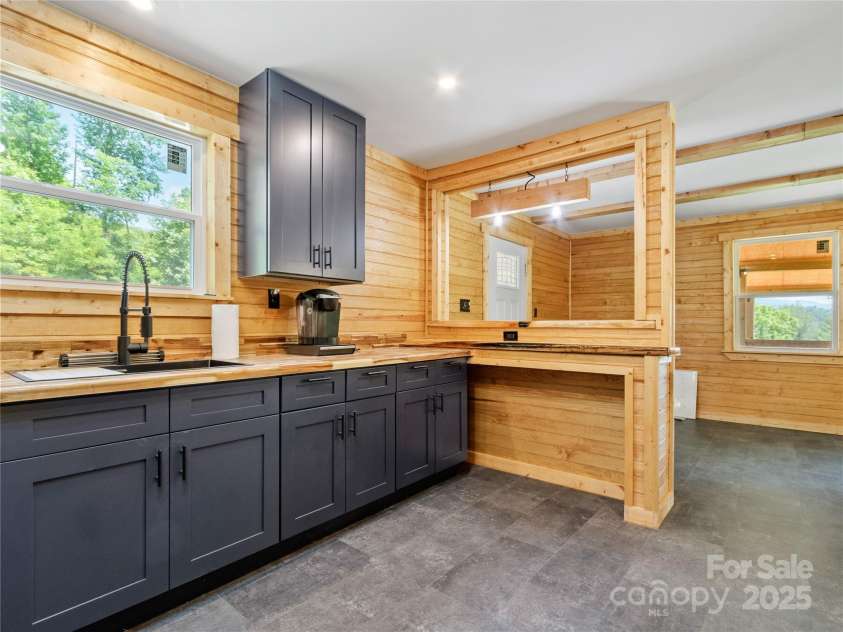 137 Red Maple Lane, Burnsville, NC 28714.  MLS# CAR4239902, YatesRealty ID 3100. Upper Level Kitchen