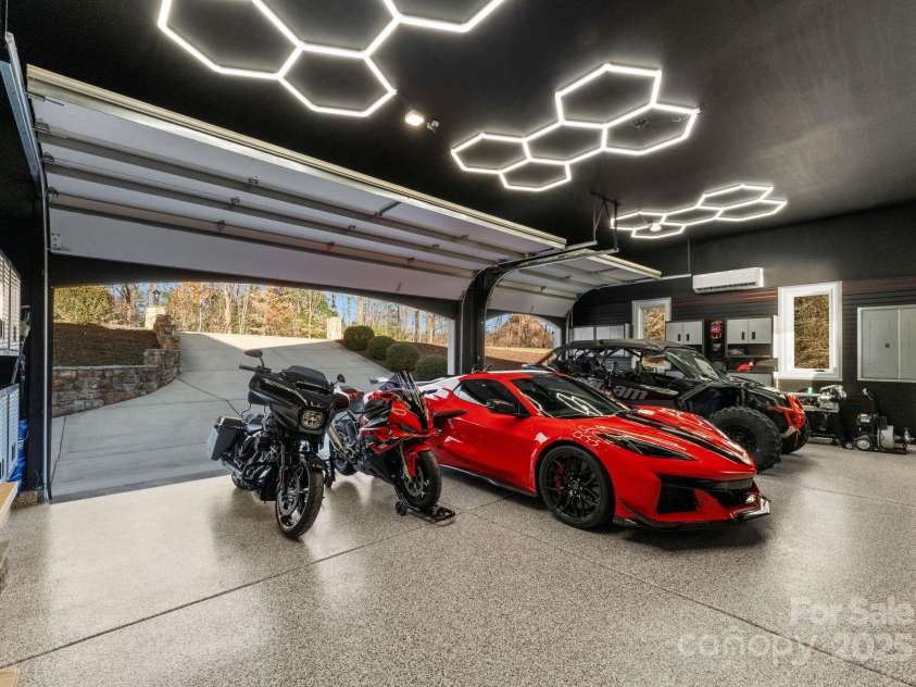 296 Windemere Isle Road, Statesville, NC 28677.  MLS# CAR4219833, YatesRealty ID 31003. Custom 3 car garage w honeycomb lighting