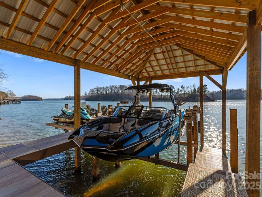 296 Windemere Isle Road, Statesville, NC 28677.  MLS# CAR4219833, YatesRealty ID 31003. Custom covered dock with BEAMLESS 10,000 lbs boat lift