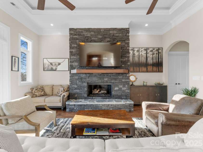 296 Windemere Isle Road, Statesville, NC 28677.  MLS# CAR4219833, YatesRealty ID 31003. Living room features custom fireplace