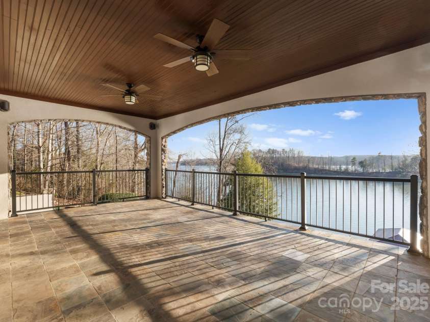 296 Windemere Isle Road, Statesville, NC 28677.  MLS# CAR4219833, YatesRealty ID 31003. Lower level covered veranda off primary suite with long range views