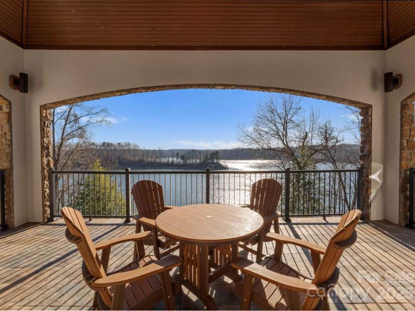 296 Windemere Isle Road, Statesville, NC 28677.  MLS# CAR4219833, YatesRealty ID 31003. Main level veranda off kitchen & living room with amazing lake view