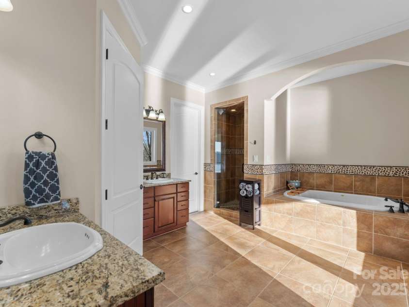 296 Windemere Isle Road, Statesville, NC 28677.  MLS# CAR4219833, YatesRealty ID 31003. Primary bathroom separate his & her vanities