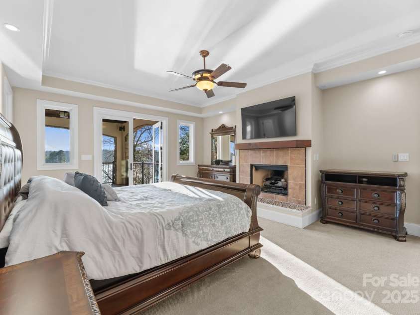 296 Windemere Isle Road, Statesville, NC 28677.  MLS# CAR4219833, YatesRealty ID 31003. Primary bedroom w/fireplace