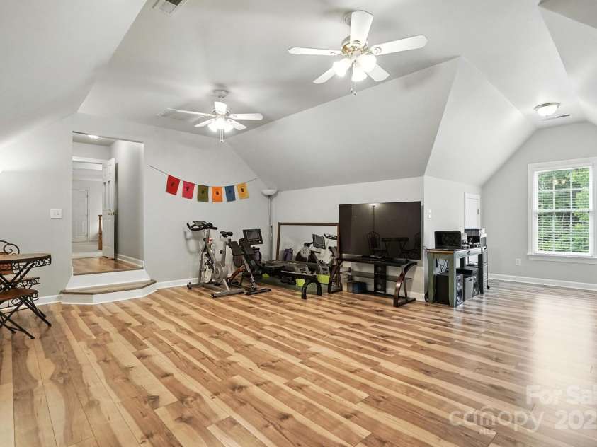 11108 Broken Brook Way, Tega Cay, SC 29708.  MLS# CAR4281529, YatesRealty ID 31004. The bonus room is a standout feature, offering ample square footage to adapt to a variety of needs. It also doubles as a 4th bedroom.