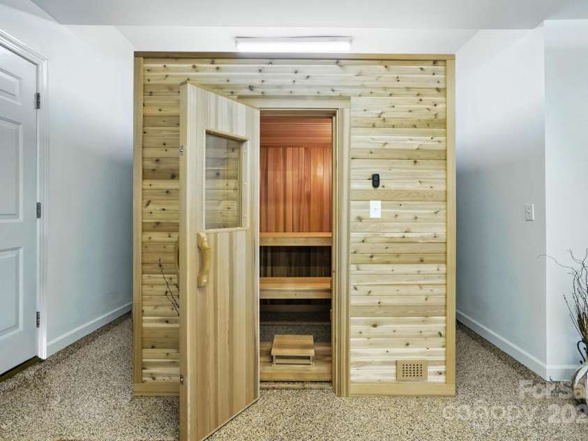 11108 Broken Brook Way, Tega Cay, SC 29708.  MLS# CAR4281529, YatesRealty ID 31004. This custom-built sauna offers a private and convenient spa experience within the comfort of your own home.