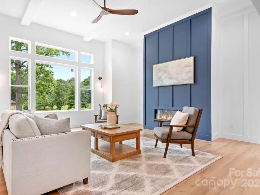 106 Arbor Drive, Waxhaw, NC 28173.  MLS# CAR4264071, YatesRealty ID 31005. Bright and welcoming living room with a pop of color and scenic views.