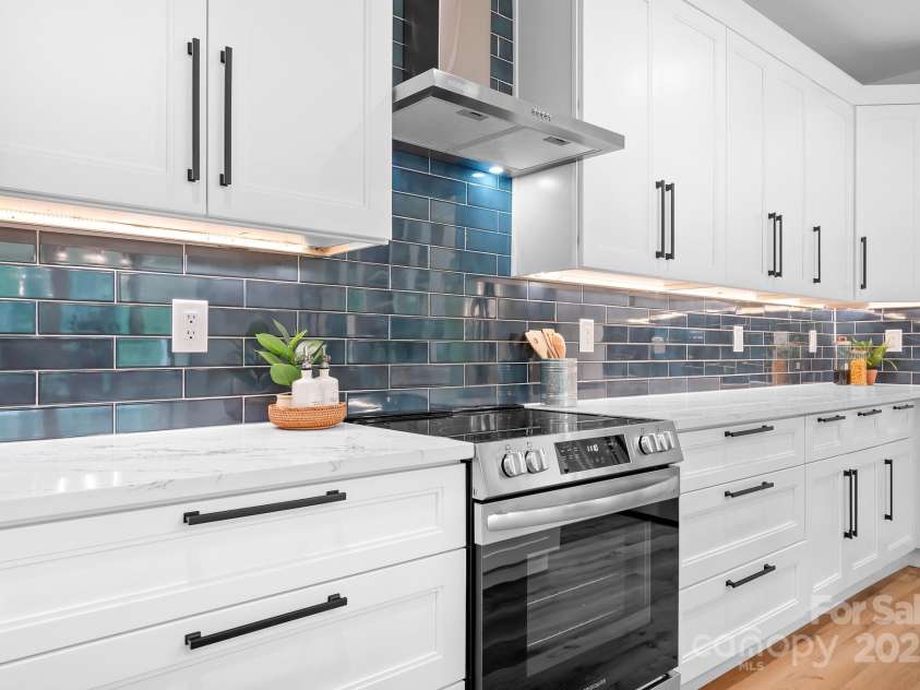 106 Arbor Drive, Waxhaw, NC 28173.  MLS# CAR4264071, YatesRealty ID 31005. The large drawers provide ample storage space, while under-cabinet lighting creates a warm, inviting glow that highlights every detail.