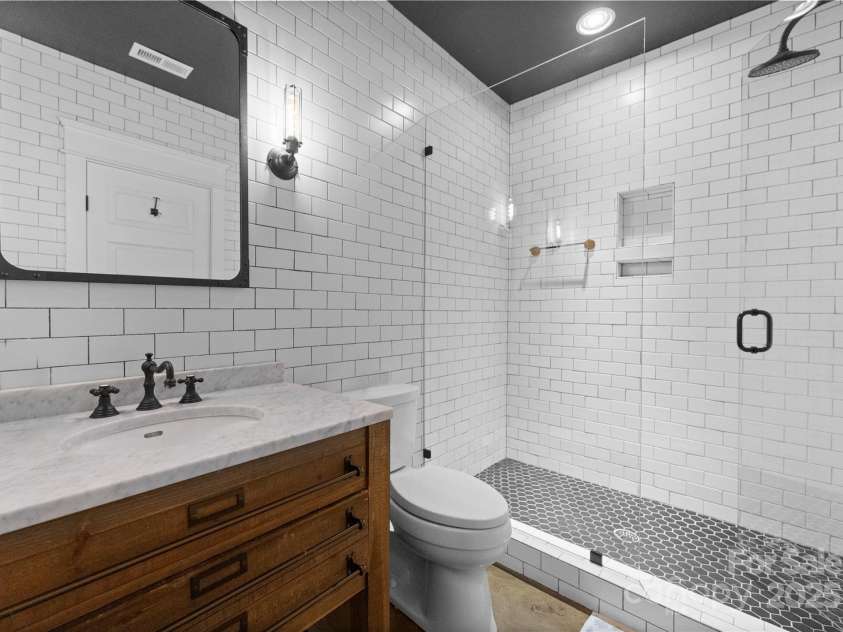 2941 Forest Park Drive, Charlotte, NC 28209.  MLS# CAR4265458, YatesRealty ID 31006. Lower level full bath adjacent to Guest suite