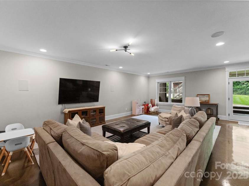 2941 Forest Park Drive, Charlotte, NC 28209.  MLS# CAR4265458, YatesRealty ID 31006. Lower level Living Area with walk-out to covered porch and fire pit, etc.