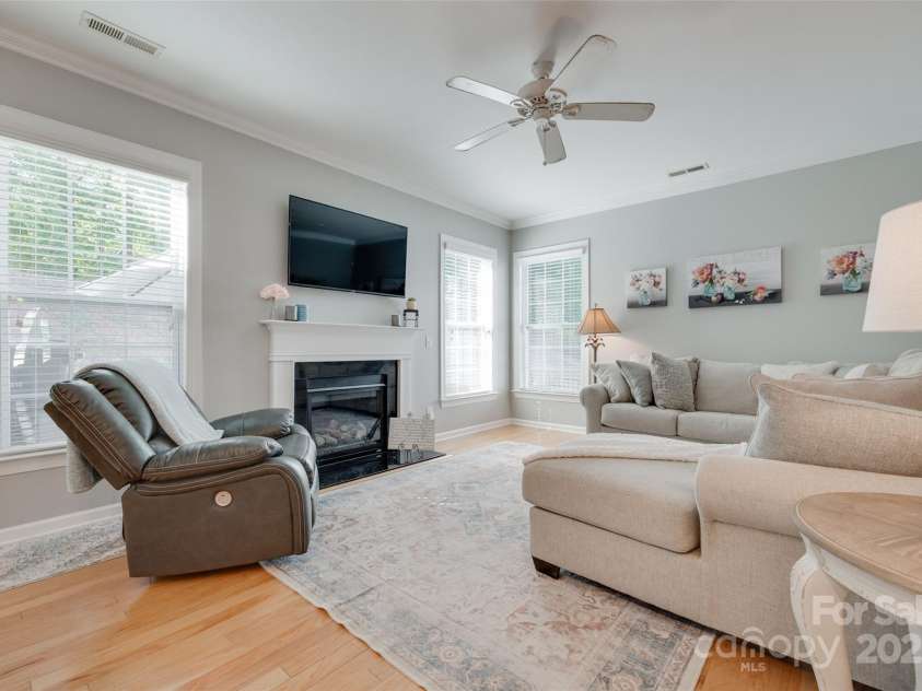 14727 Brannock Hills Drive, Charlotte, NC 28278.  MLS# CAR4266580, YatesRealty ID 31016. The large open living room has a gas fireplace.