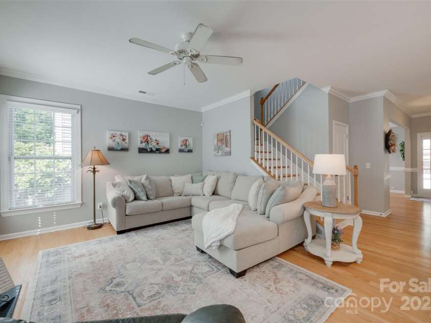 14727 Brannock Hills Drive, Charlotte, NC 28278.  MLS# CAR4266580, YatesRealty ID 31016. The living room is large and bright with floor to ceiling windows and high ceilings.
