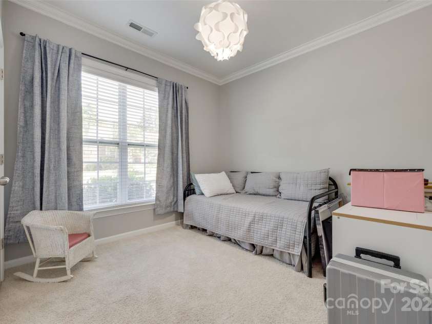 14727 Brannock Hills Drive, Charlotte, NC 28278.  MLS# CAR4266580, YatesRealty ID 31016. The second bedroom has a large closet and floor to ceiling windows.