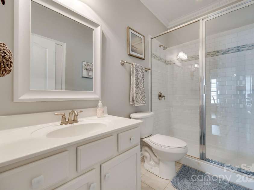 14727 Brannock Hills Drive, Charlotte, NC 28278.  MLS# CAR4266580, YatesRealty ID 31016. The second full bathroom features a walk in shower.