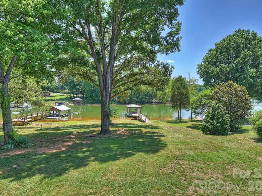 113 Skippers Cove Lane, Troutman, NC 28166.  MLS# CAR4393829, YatesRealty ID 31018. Genlty Sloping Backyard