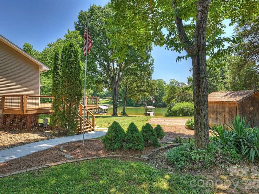 113 Skippers Cove Lane, Troutman, NC 28166.  MLS# CAR4393829, YatesRealty ID 31018. Side Yard