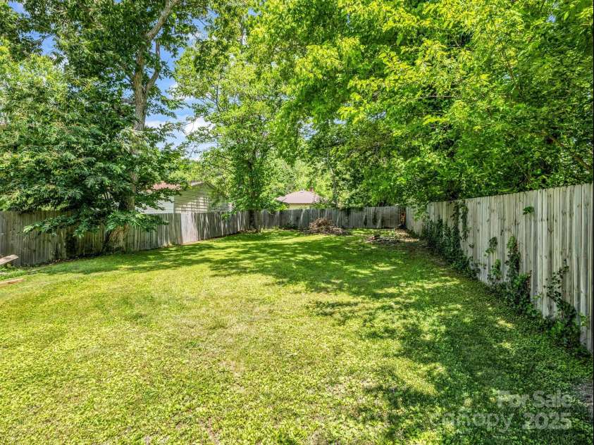 226 Substation Street, Hendersonville, NC 28792.  MLS# CAR4265735, YatesRealty ID 31036. Spacious Fenced Back Yard