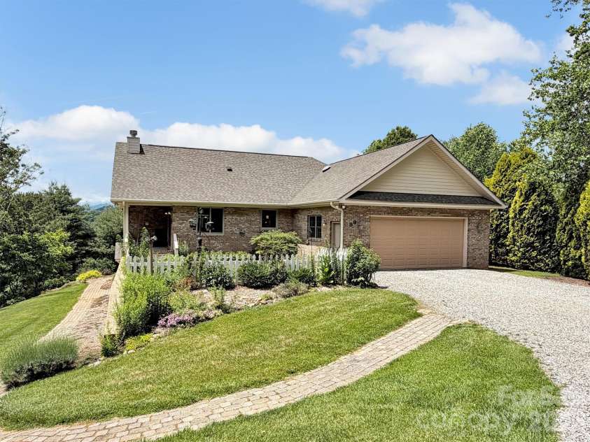 99 Mary Gray Drive, Clyde, NC 28721.  MLS# CAR4389889, YatesRealty ID 31036. Gorgeous Landscaping