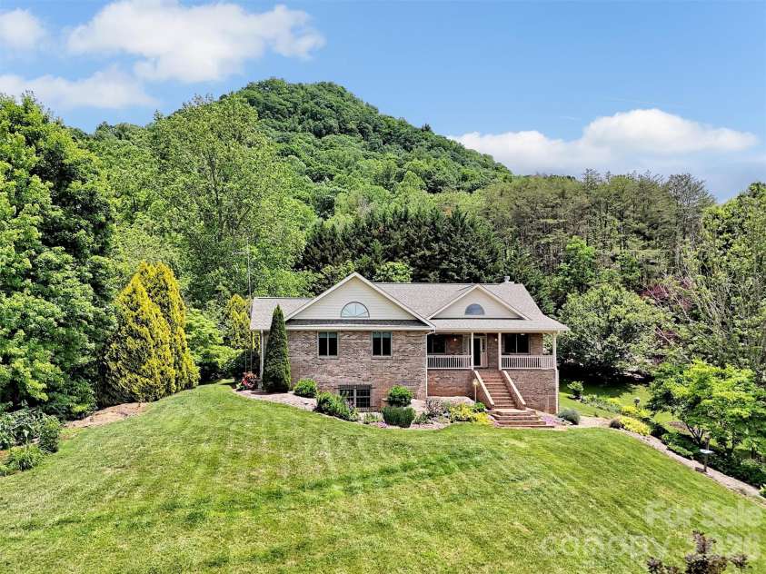 99 Mary Gray Drive, Clyde, NC 28721.  MLS# CAR4389889, YatesRealty ID 31036. Picturesque Setting