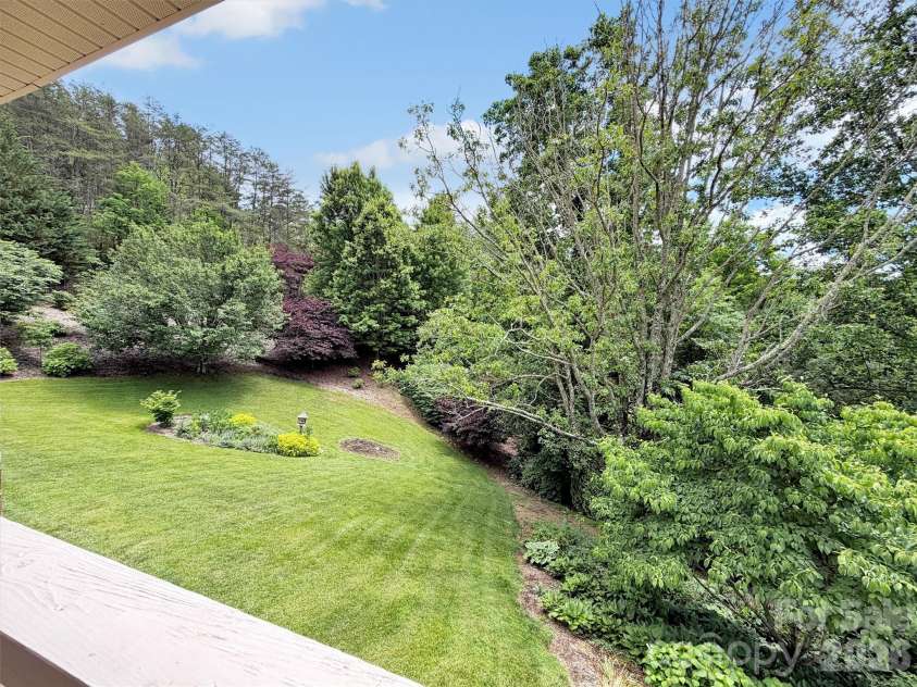 99 Mary Gray Drive, Clyde, NC 28721.  MLS# CAR4389889, YatesRealty ID 31036. Surrounded by Beautiful Gardens
