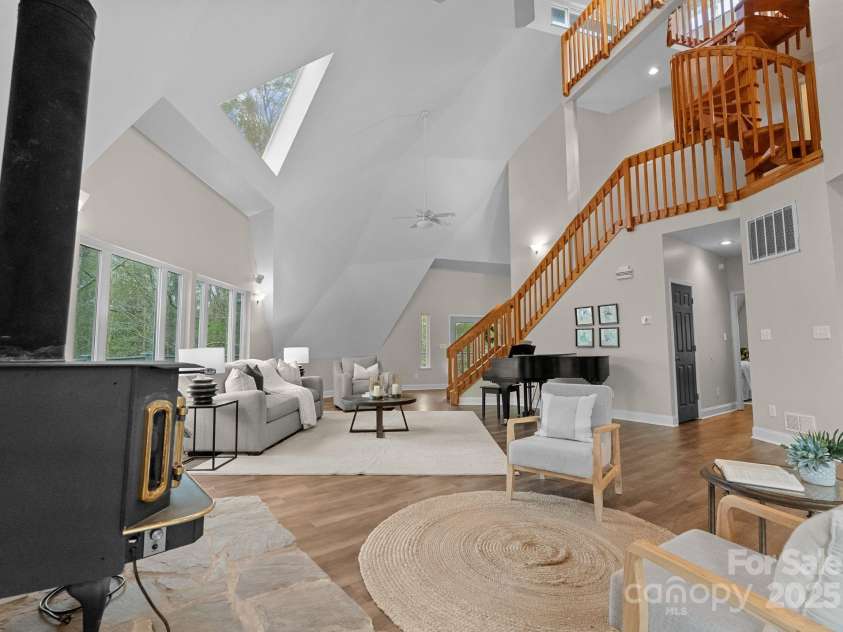 10200 Amsterdam Drive, Mount Pleasant, NC 28124.  MLS# CAR4213612, YatesRealty ID 31037. 2.5 story Great room with a stunning spiral stair case and beautiful wood work