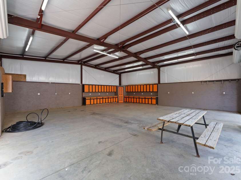 10200 Amsterdam Drive, Mount Pleasant, NC 28124.  MLS# CAR4213612, YatesRealty ID 31037. Can fit several vehicles- previously used to hold large, motorized equipment for homesteading the property